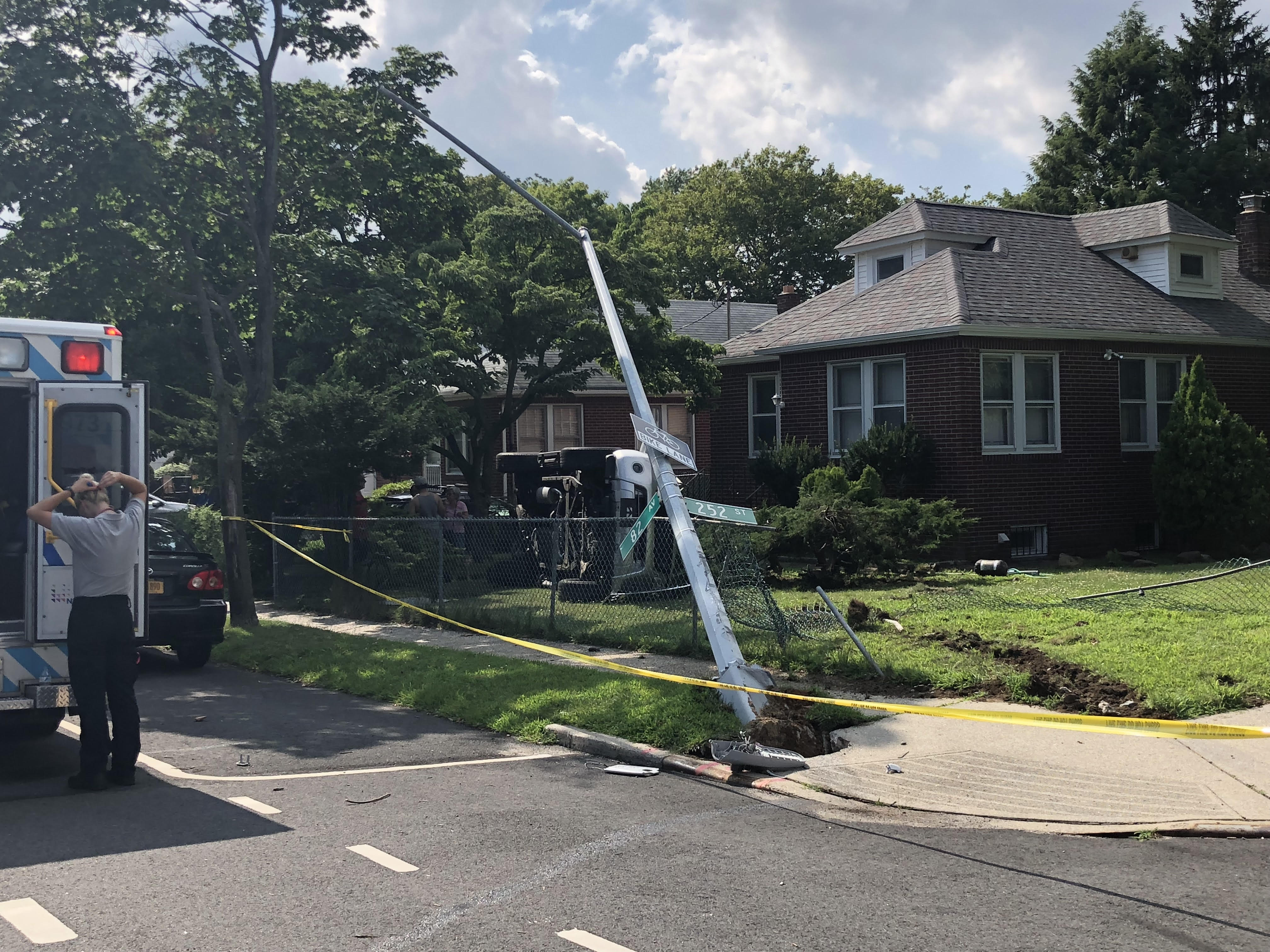 Car rolled over in Bellerose.