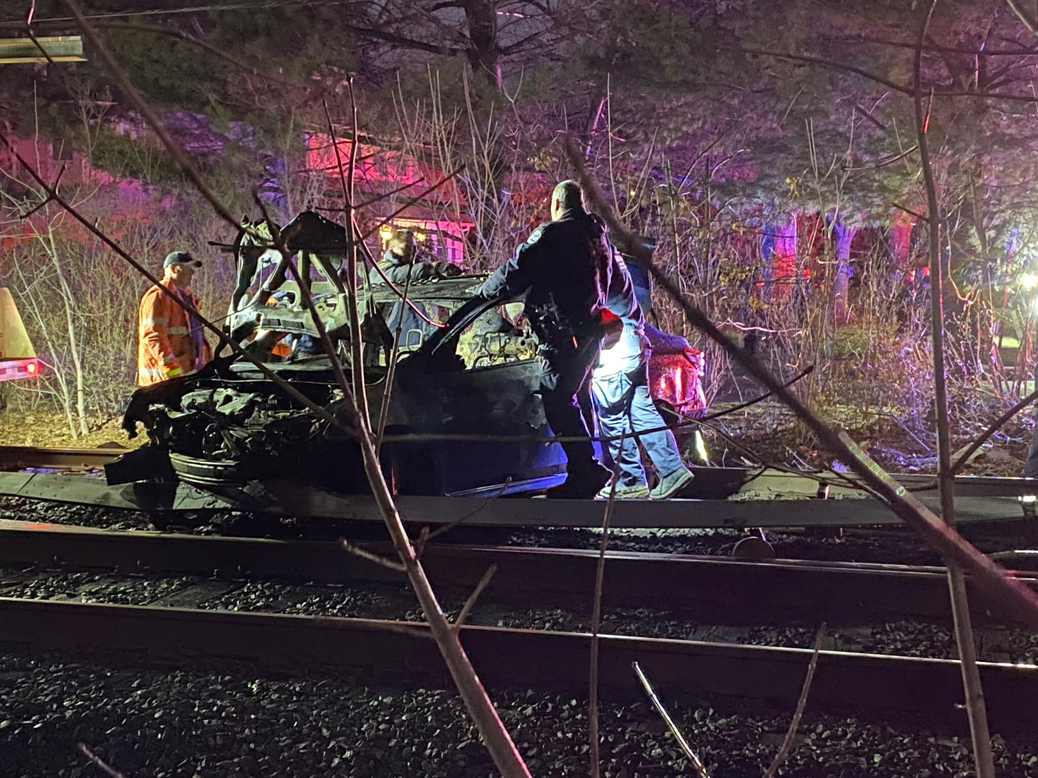 Car fire on the train tracks in Garden City.