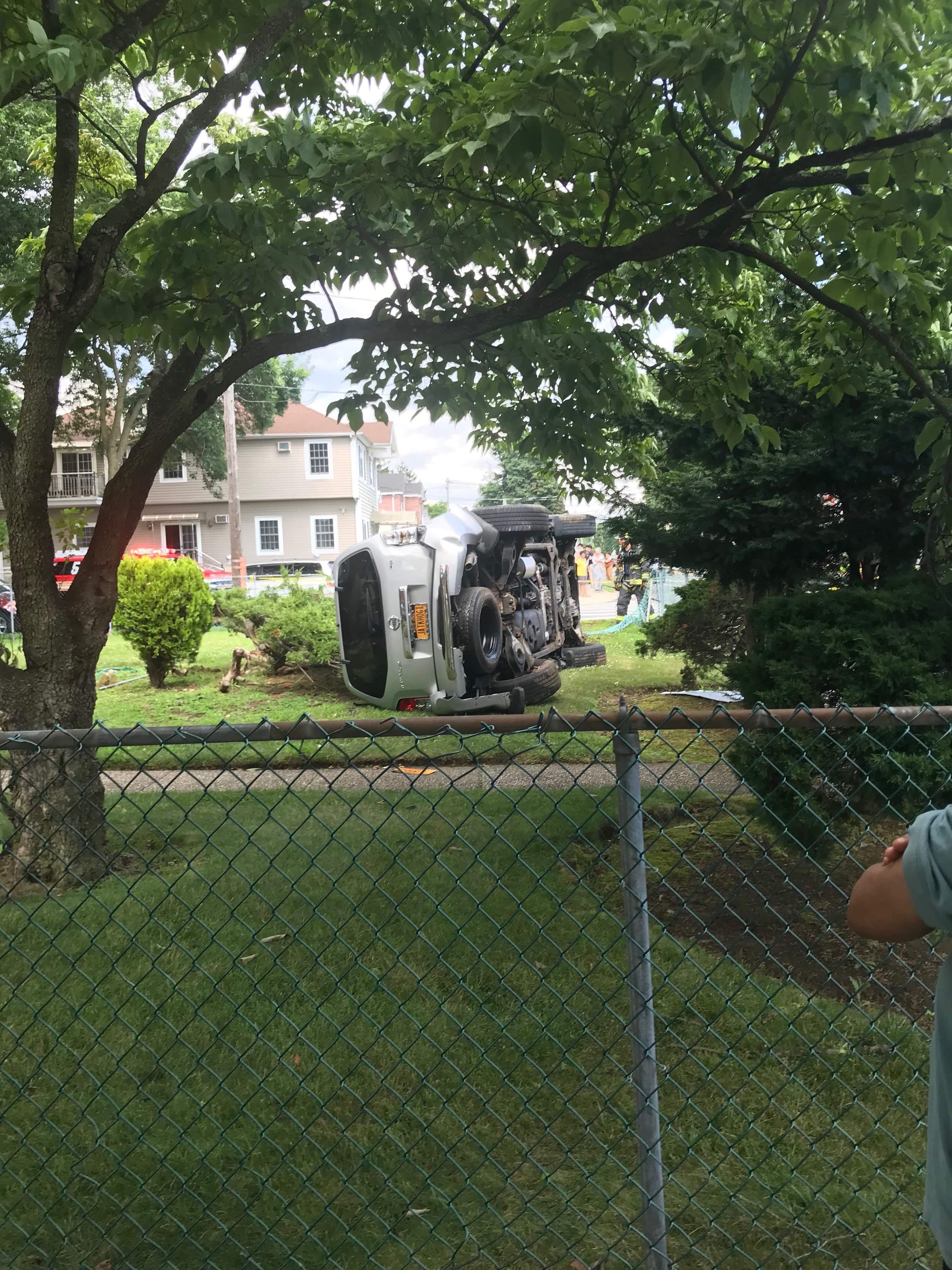 Car rolled over in Bellerose.