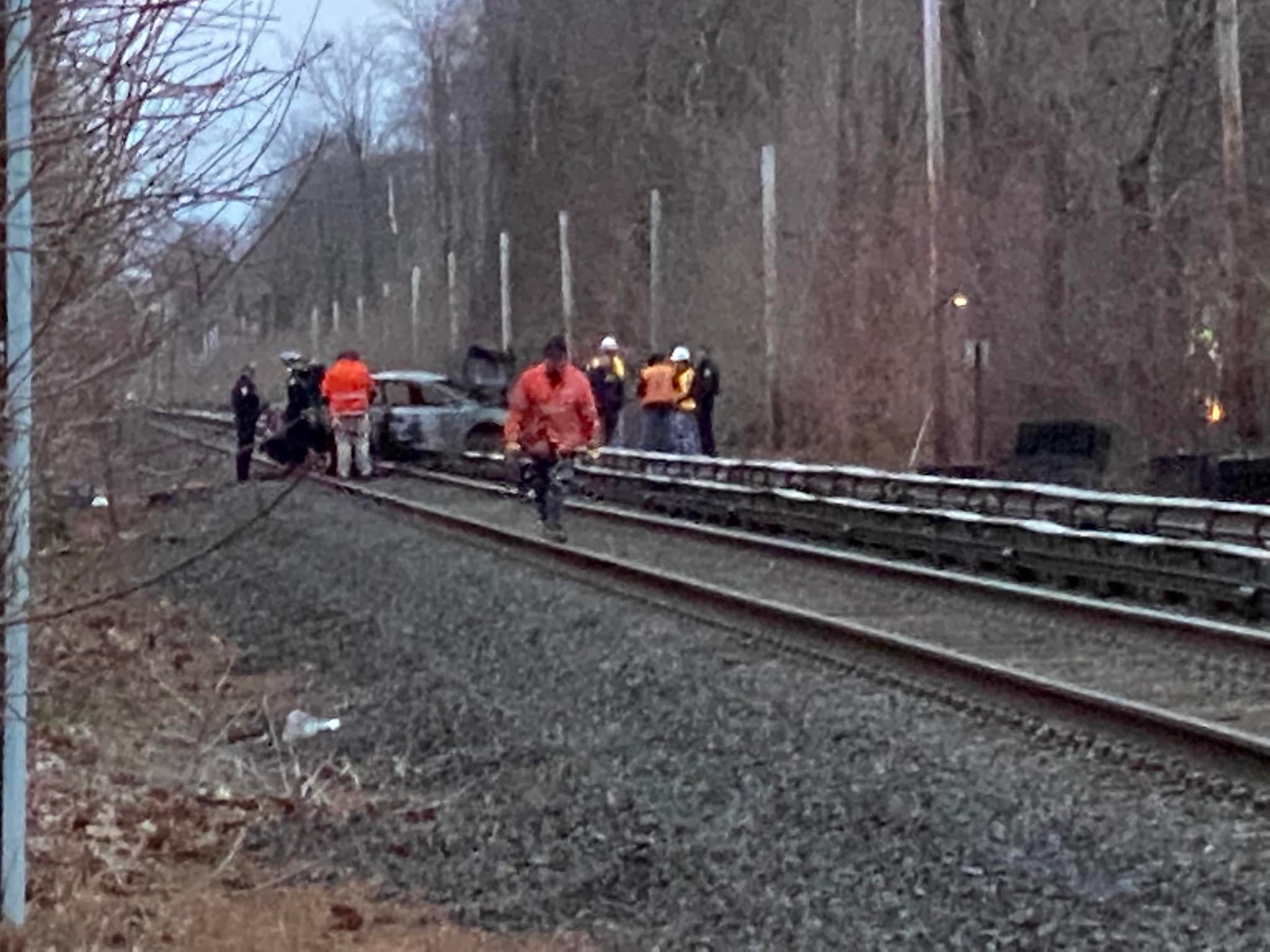 Car fire on the train tracks in Garden City.