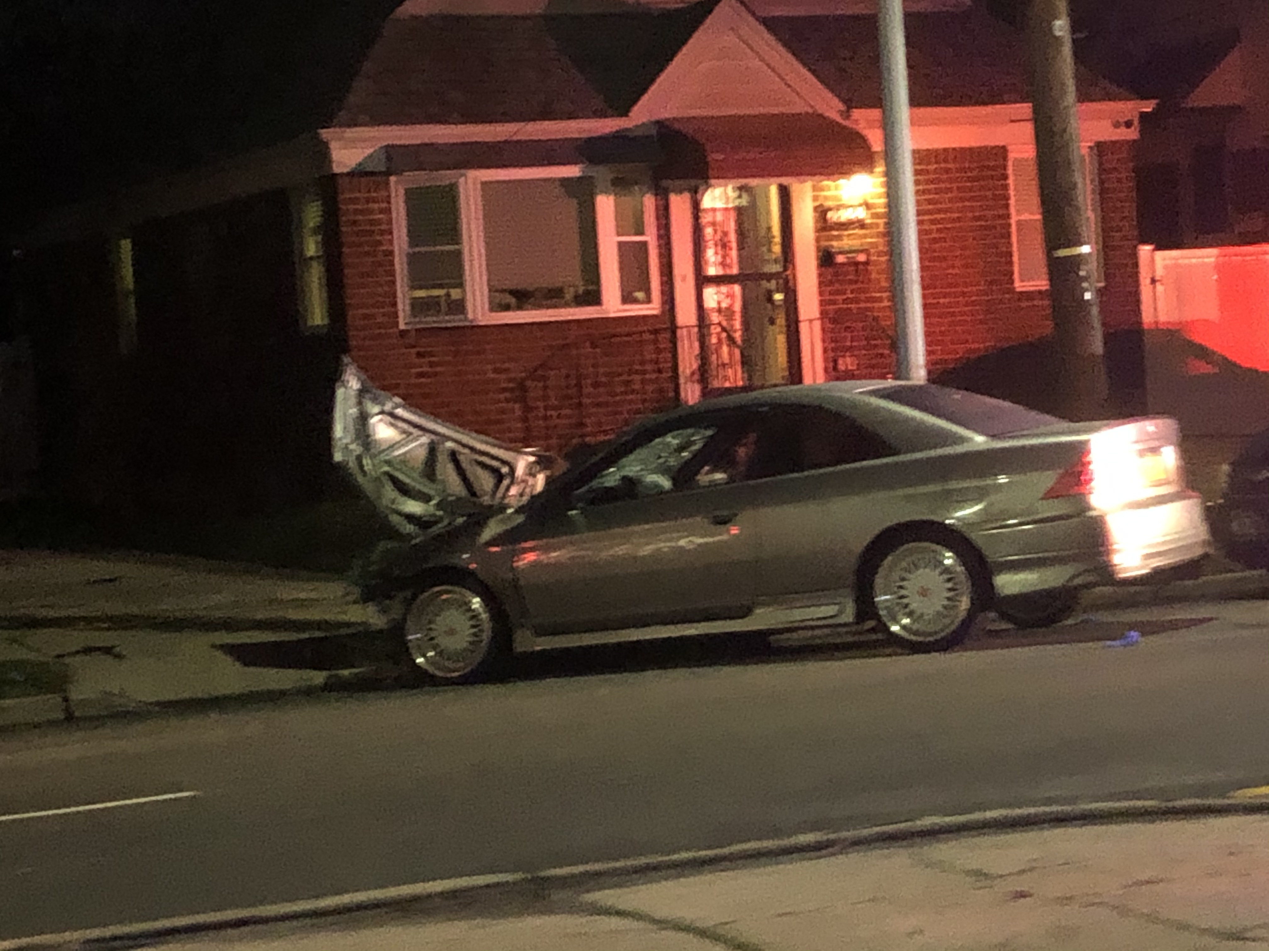 Vehicle crash in Floral Park at night.