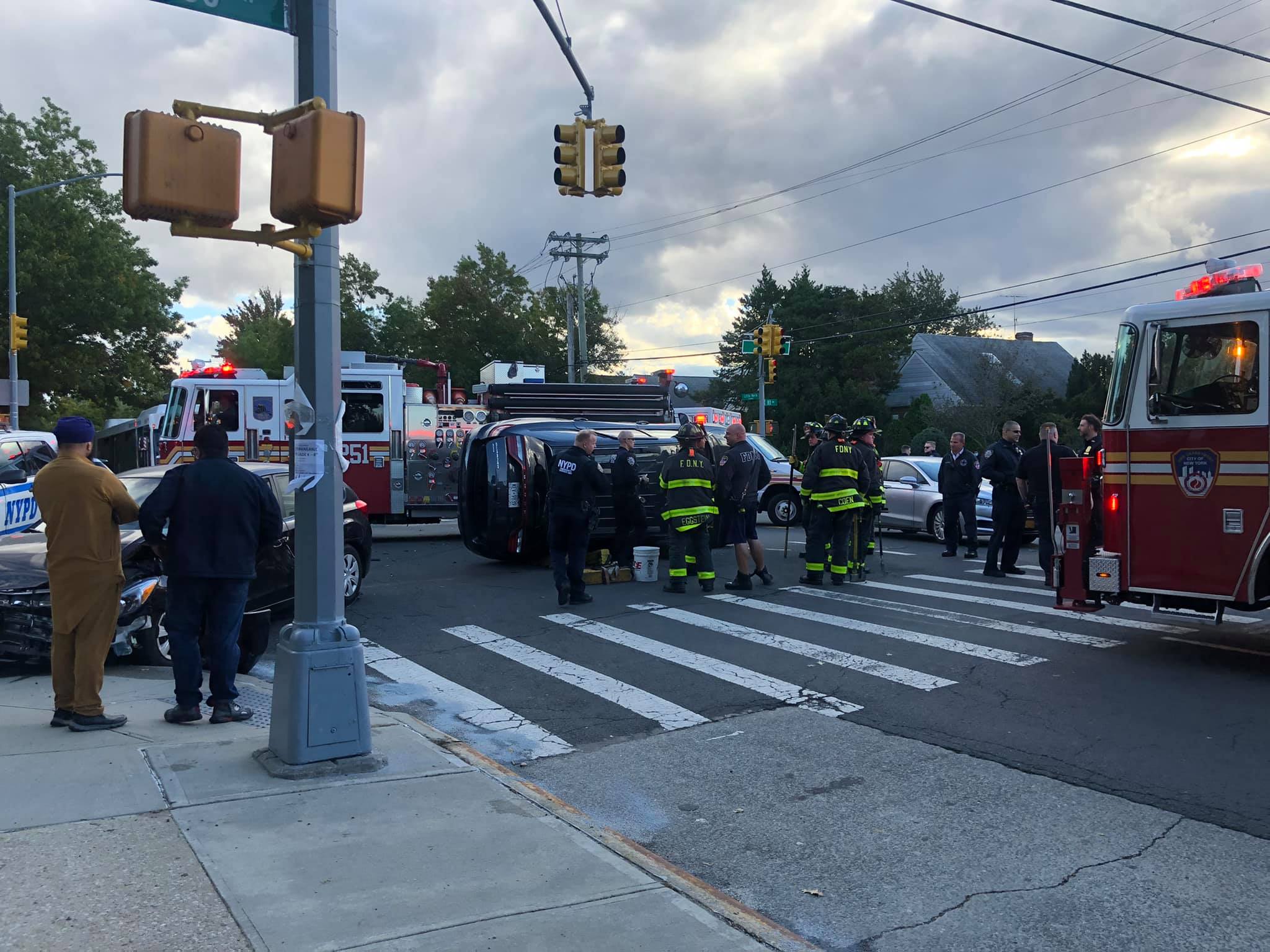 Multiple vehicle accident with one flipped on Little Neck Parkway in Bellerose.